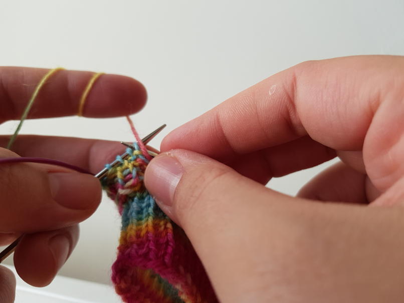 A finger yarn holder I made to help keep the tension in the yarn and keep  my hand from cramping. Works great!