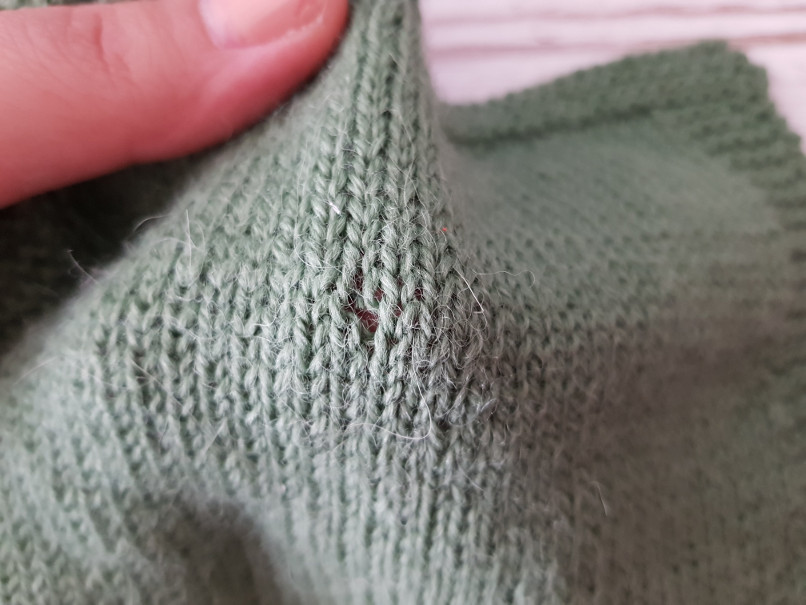 darn knits - "Moth" hole. This can be fixed with swiss darning.